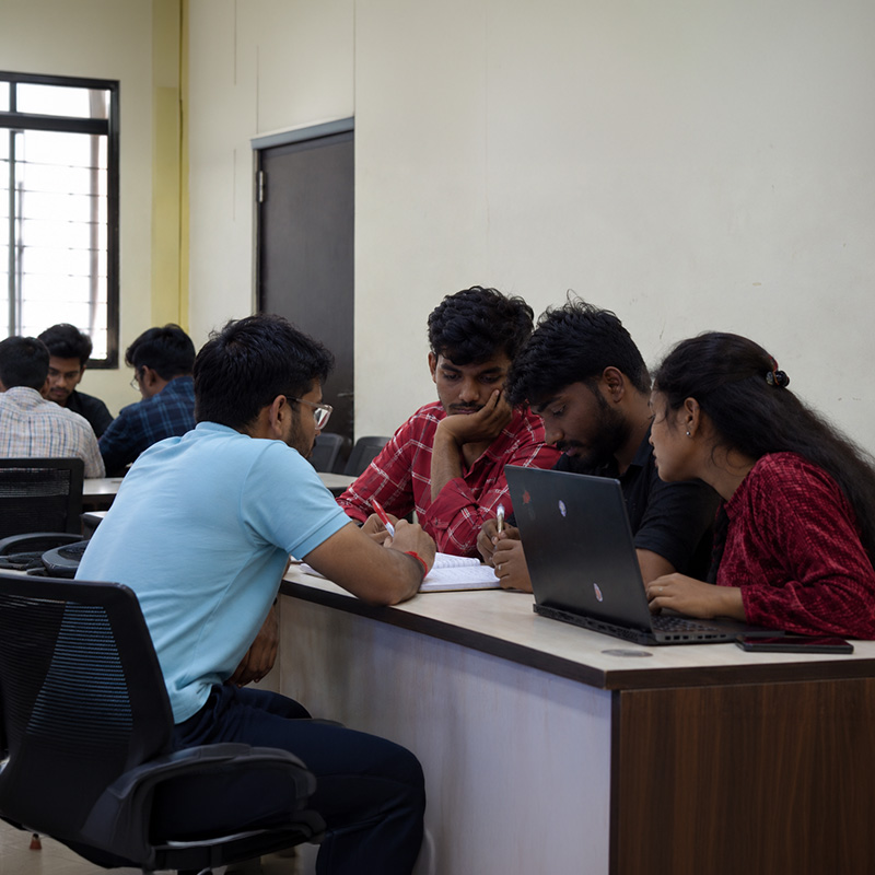 Mentor helping a student with a case study at ScholarLogic