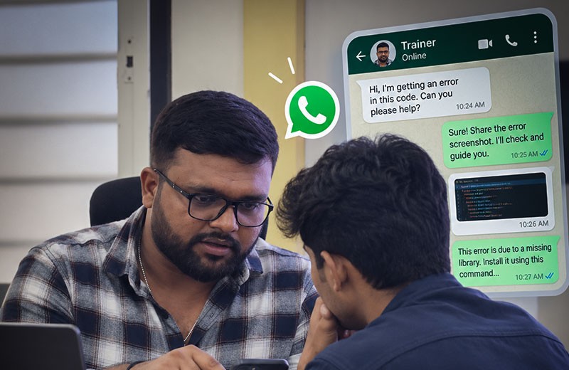 A trainer helping a student with a coding problem